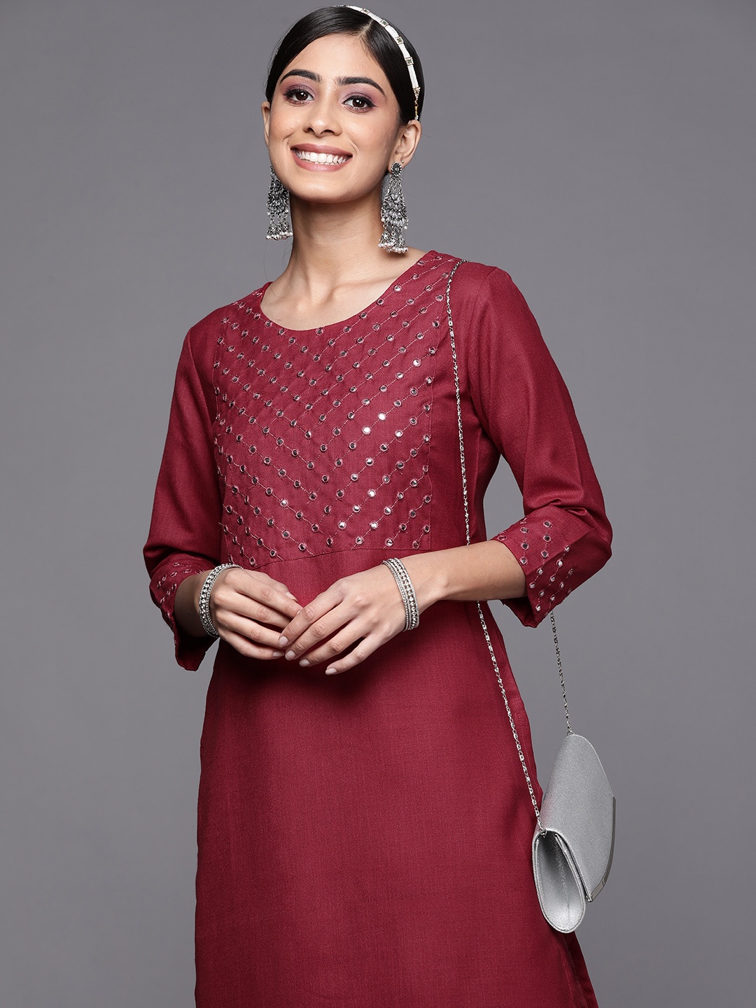 

Indo Era Women Maroon Ethnic Motifs Yoke Design Mirror Work Kurta with Palazzos