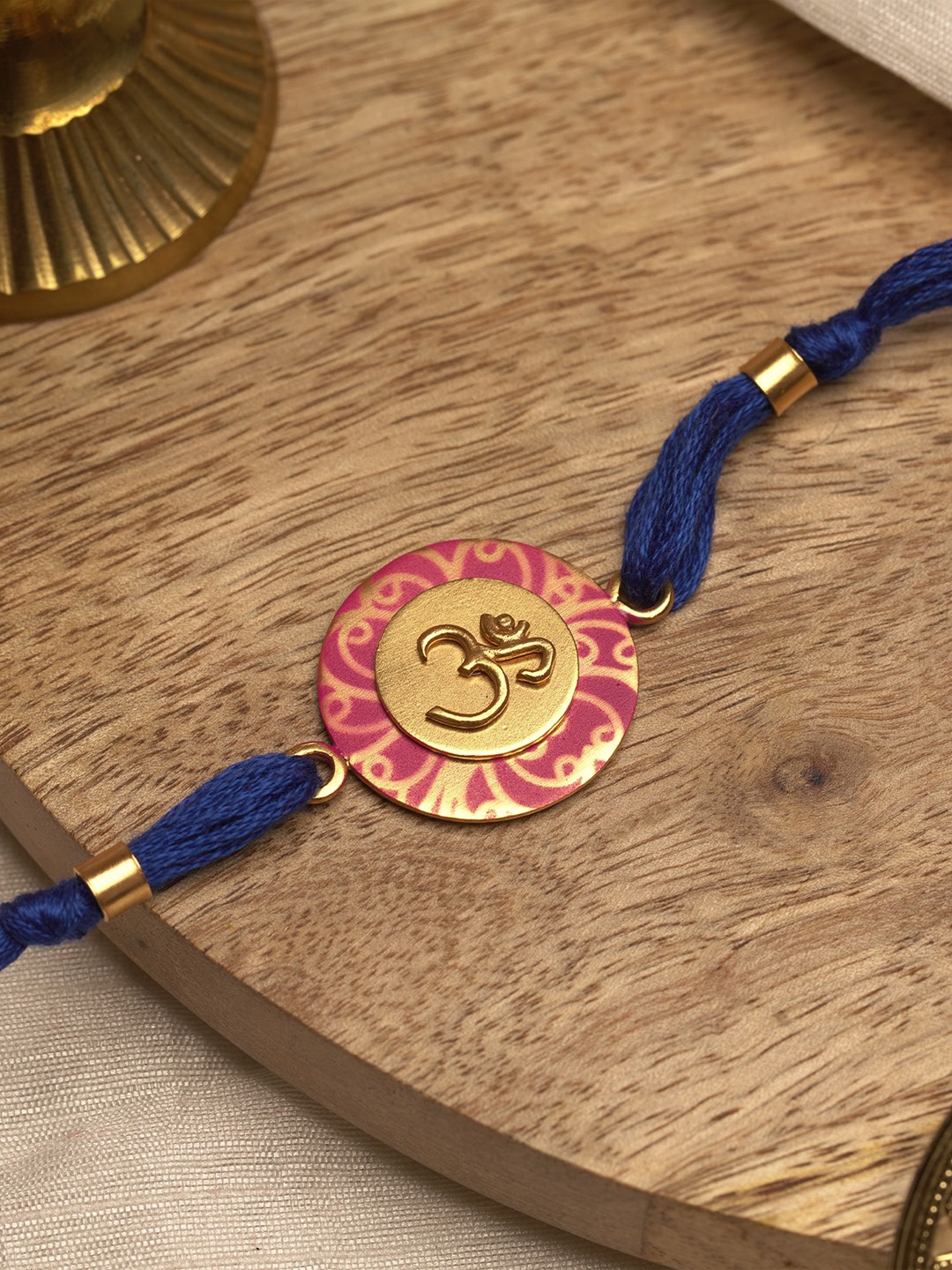 

Suhani Pittie Men Gold-Toned Designed & Blue Threaded Rakhi