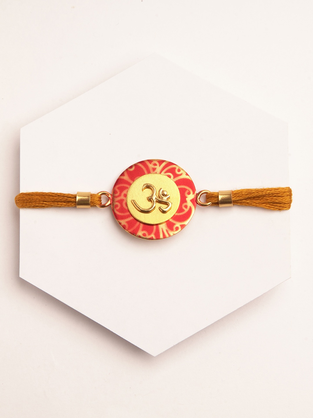 

Suhani Pittie Men Gold-Plated Mustard & Gold-Toned OM Embedded Rakhi Rakhi