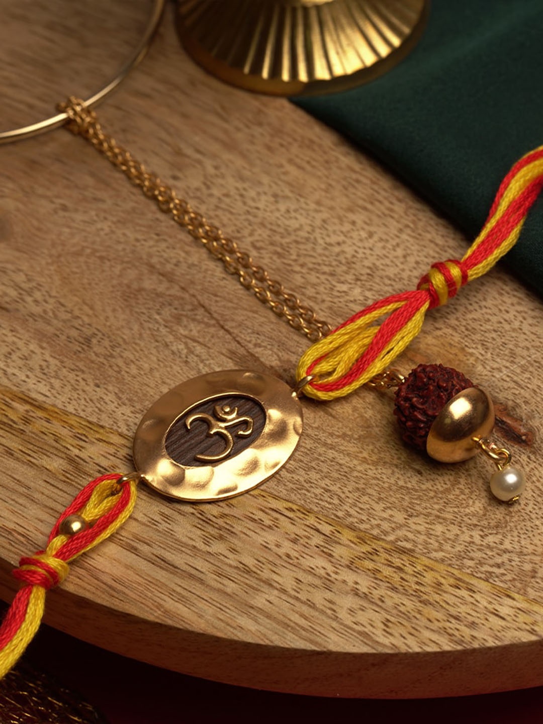 

Suhani Pittie Red & Gold-Toned & Plated Lumba & Rakhi Set
