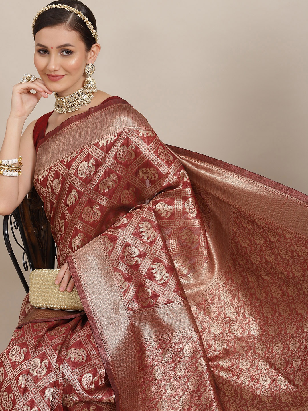 

Saree mall Maroon Ethnic Motifs Zari Patola Sarees