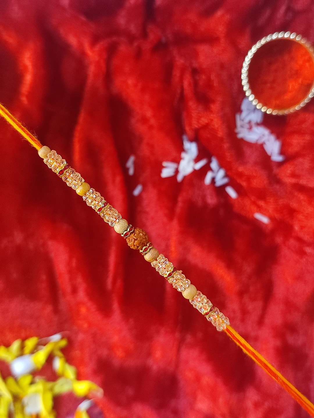 

CRAYTON Men Beige & Red Stone-Studded & Rudraksha-Beaded Rakhi