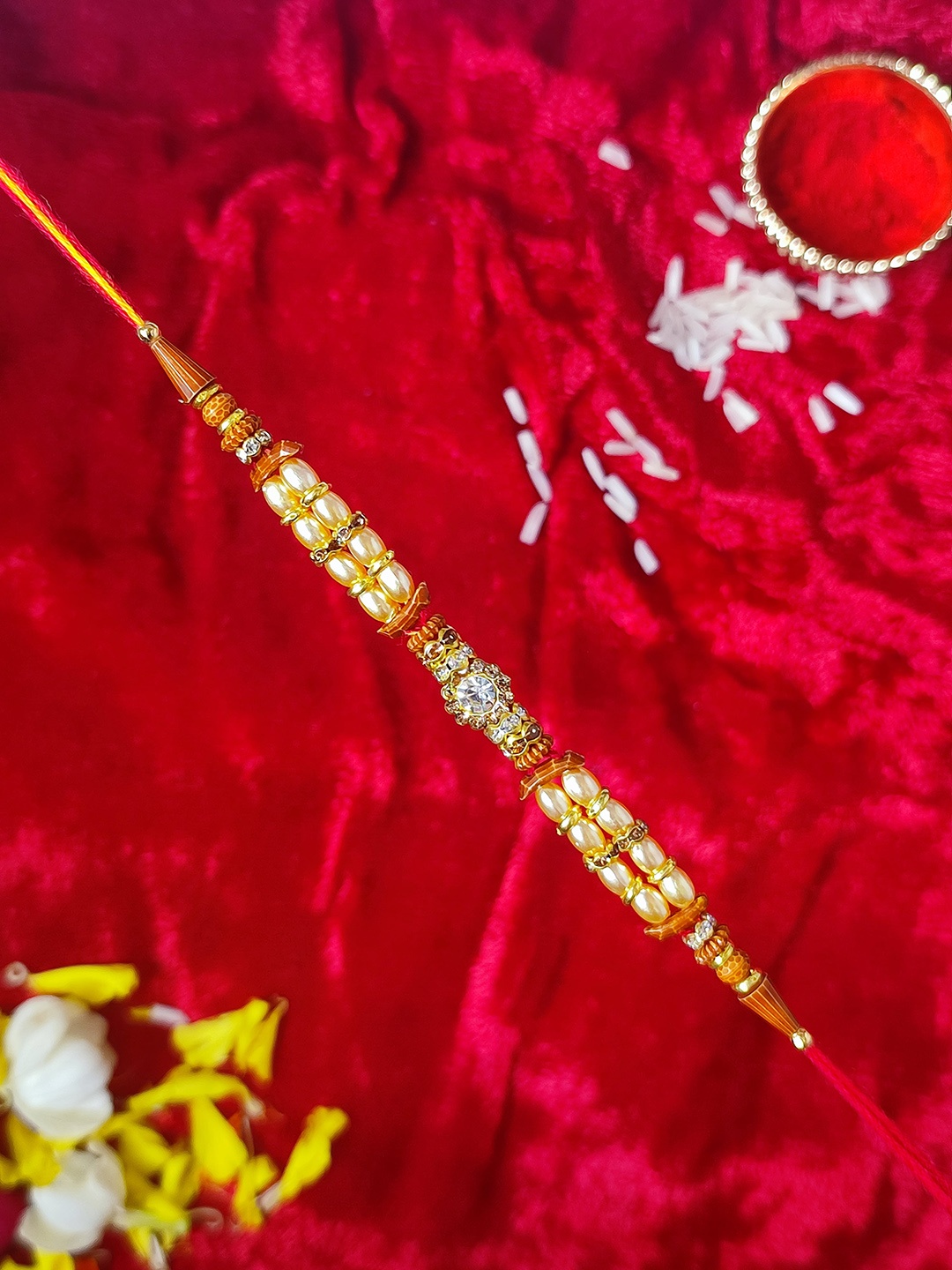 

CRAYTON Red & Yellow Beaded Thread Rakhi With Roli-Chawal