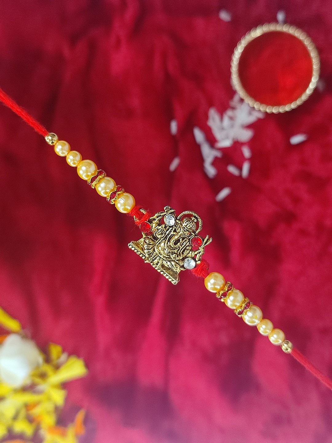 

CRAYTON Men Red Ganpati Designed & Cream Colored Pearl Beaded Rakhi