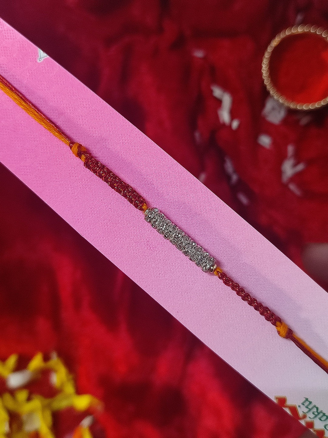 

CRAYTON Silver Toned & White Studed Spring Thread Rakhi