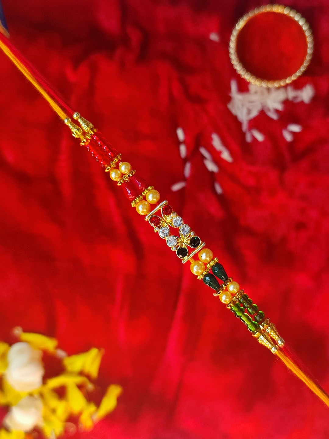 

CRAYTON Men Gold-Toned White & Red Stone-Studded & Beaded Rakhi