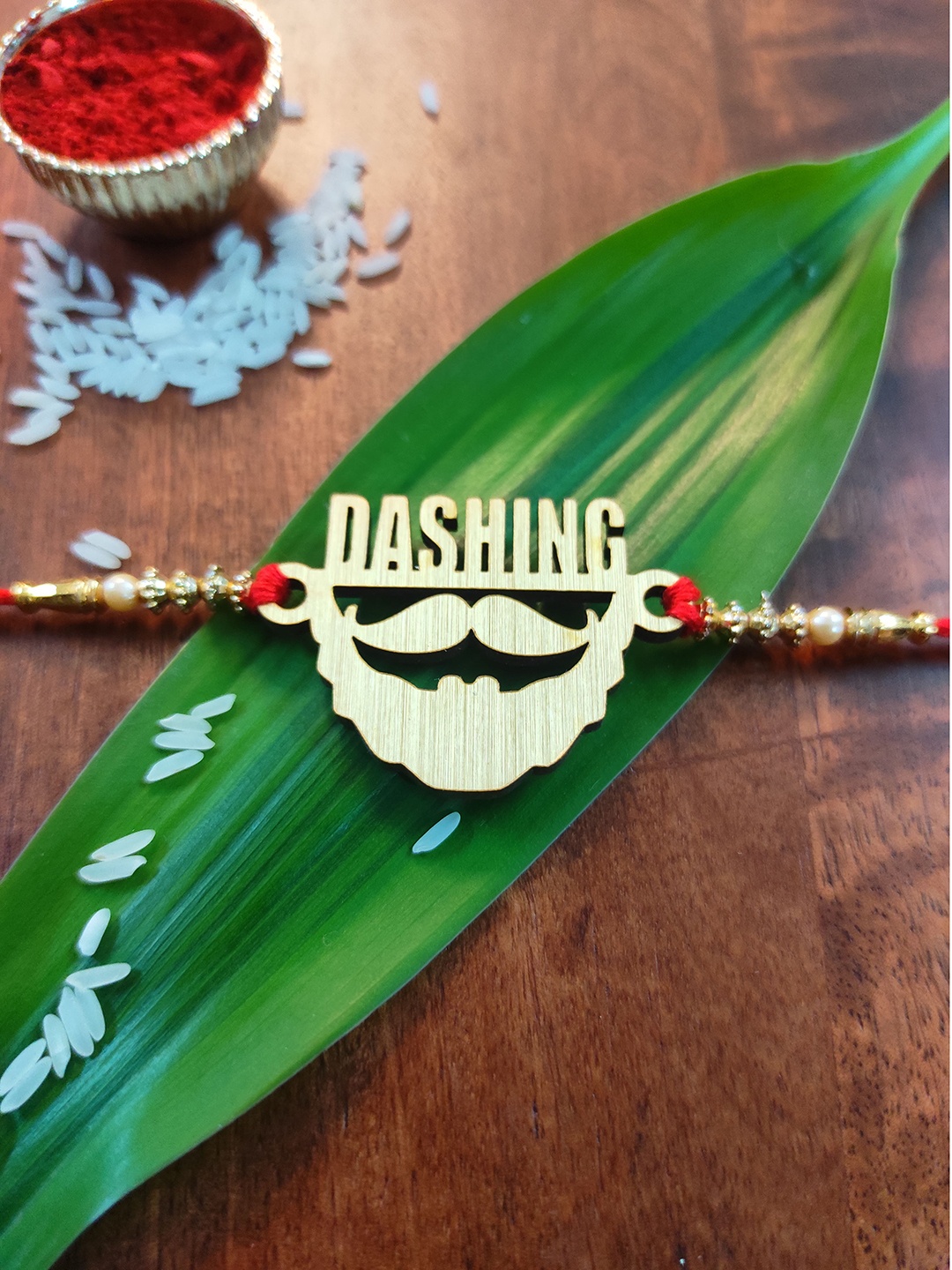

CRAYTON Gold Toned & Red Beaded Rakhi
