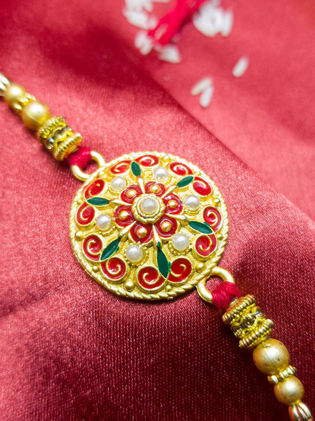 

CRAYTON Gold Toned & Red Meenakari Pearls Studded & Beaded Rakhi