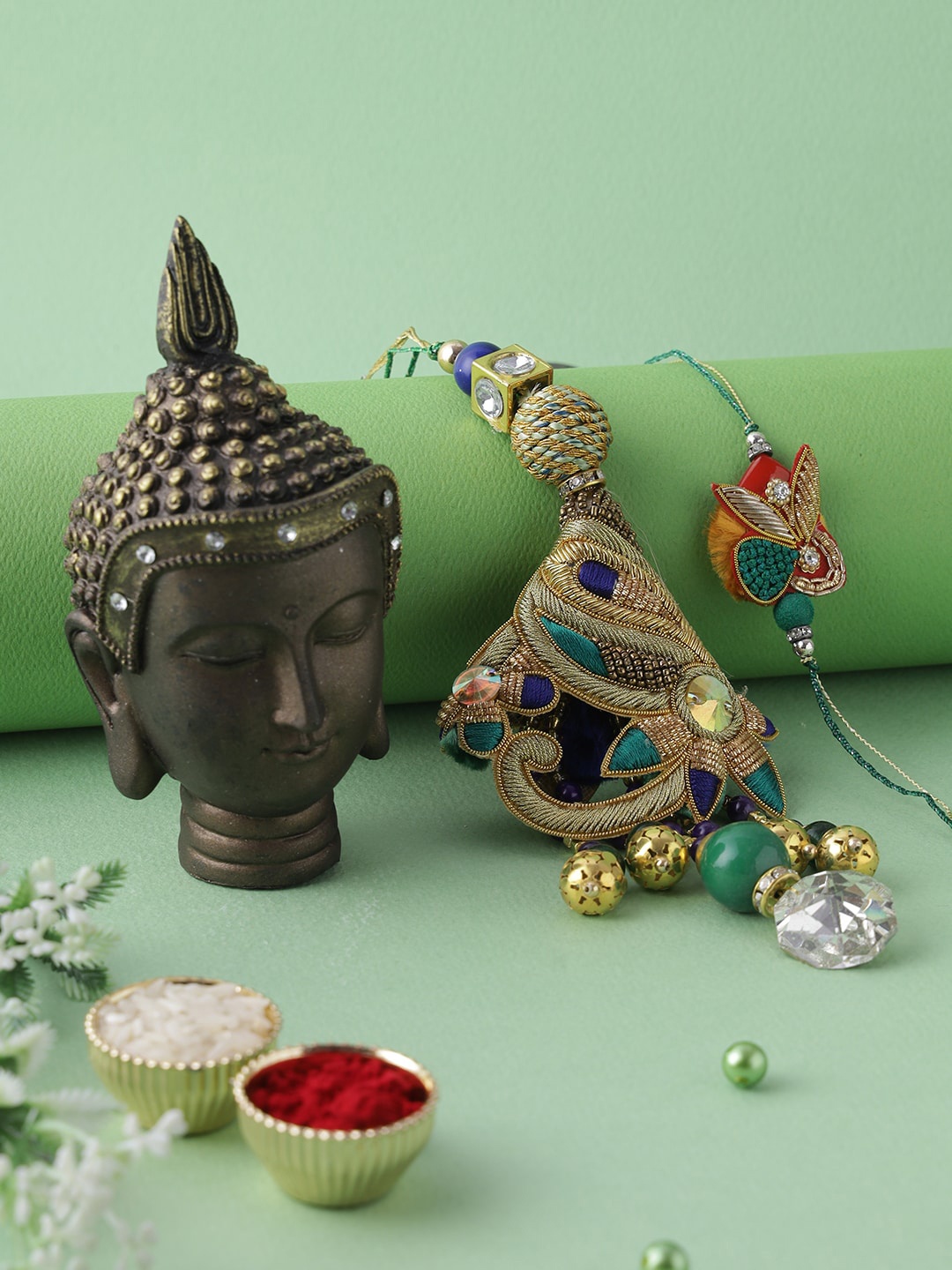 

Aapno Rajasthan Multi Buddha Resin Art with Bhaiya Bhabhi Rakhi Gift Set