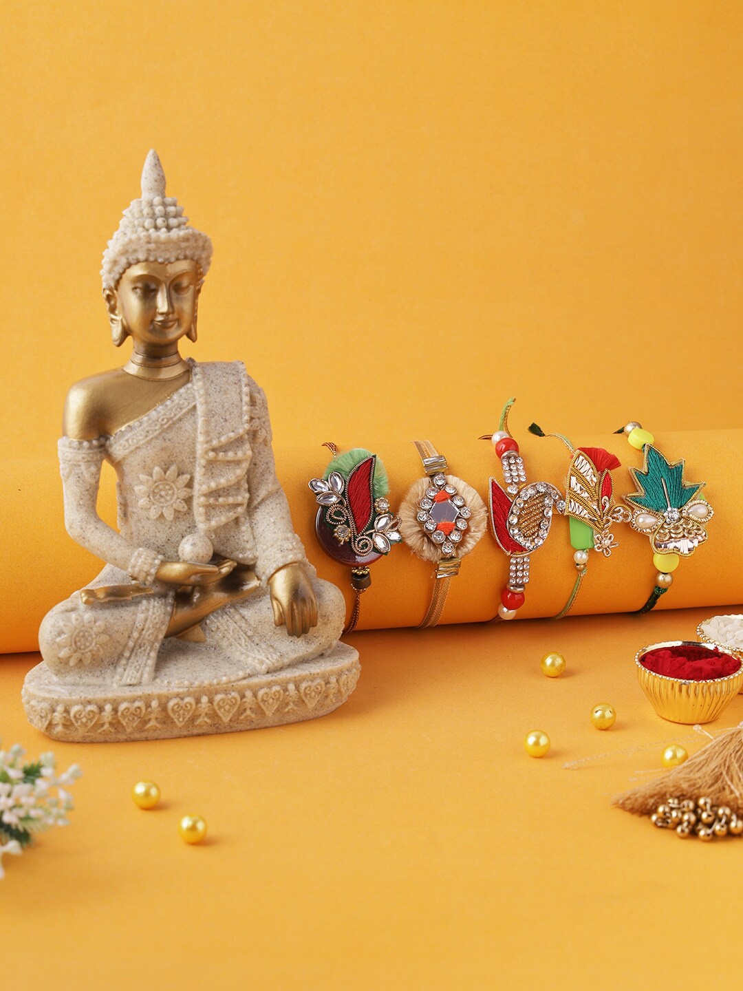 

Aapno Rajasthan Set Of 5 Multicolor Meditating Buddha Statue With Rakhi Set, Beige
