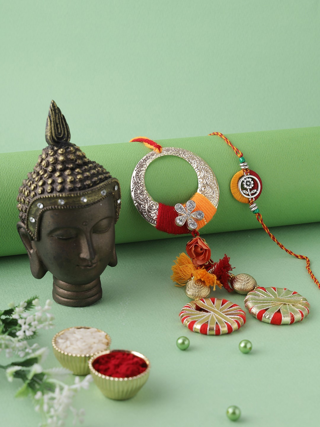 

Aapno Rajasthan Red & Gold-Toned Minimalist Buddha Rakhi Gift Set