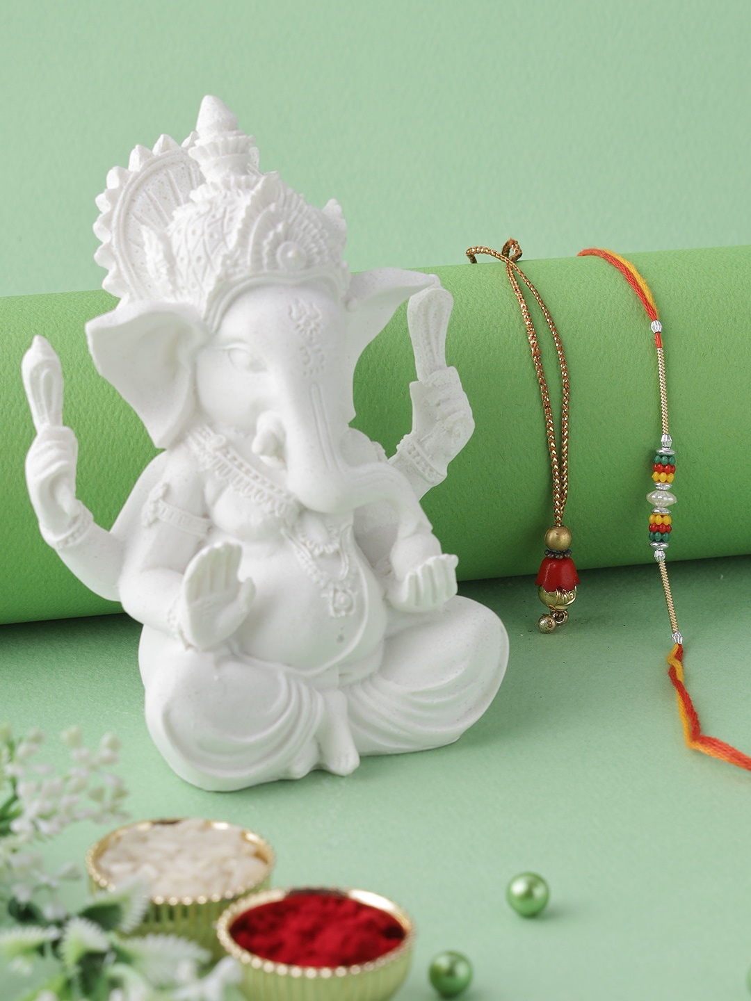 

Aapno Rajasthan Set Of 2 White Ganesha Idol With Bhaiya Bhabhi Rakhi Gift Set
