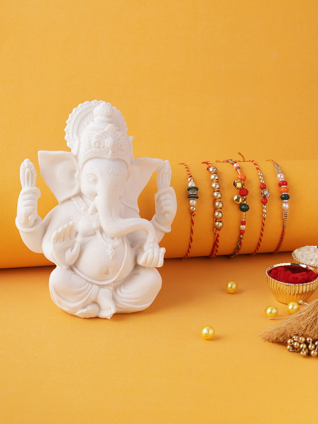 

Aapno Rajasthan Red & Gold-Toned Ganesha Rakhi Gift Set of 5