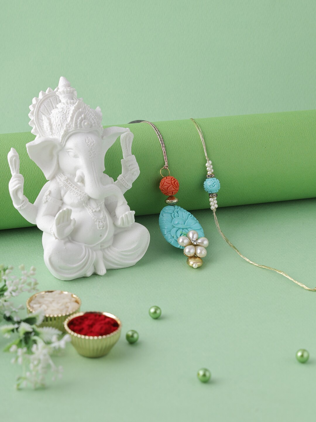

Aapno Rajasthan Set of 2 Blue & Red Bhaiya Bhabhi Rakhi with Ganesha Idol