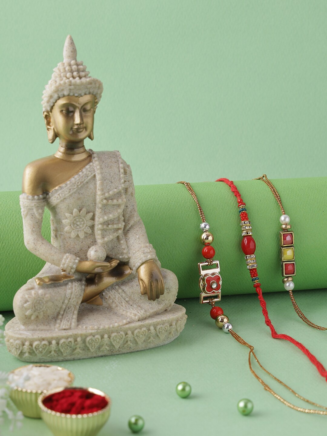 

Aapno Rajasthan Red & Gold-Toned Buddha Rakhi Gift Set