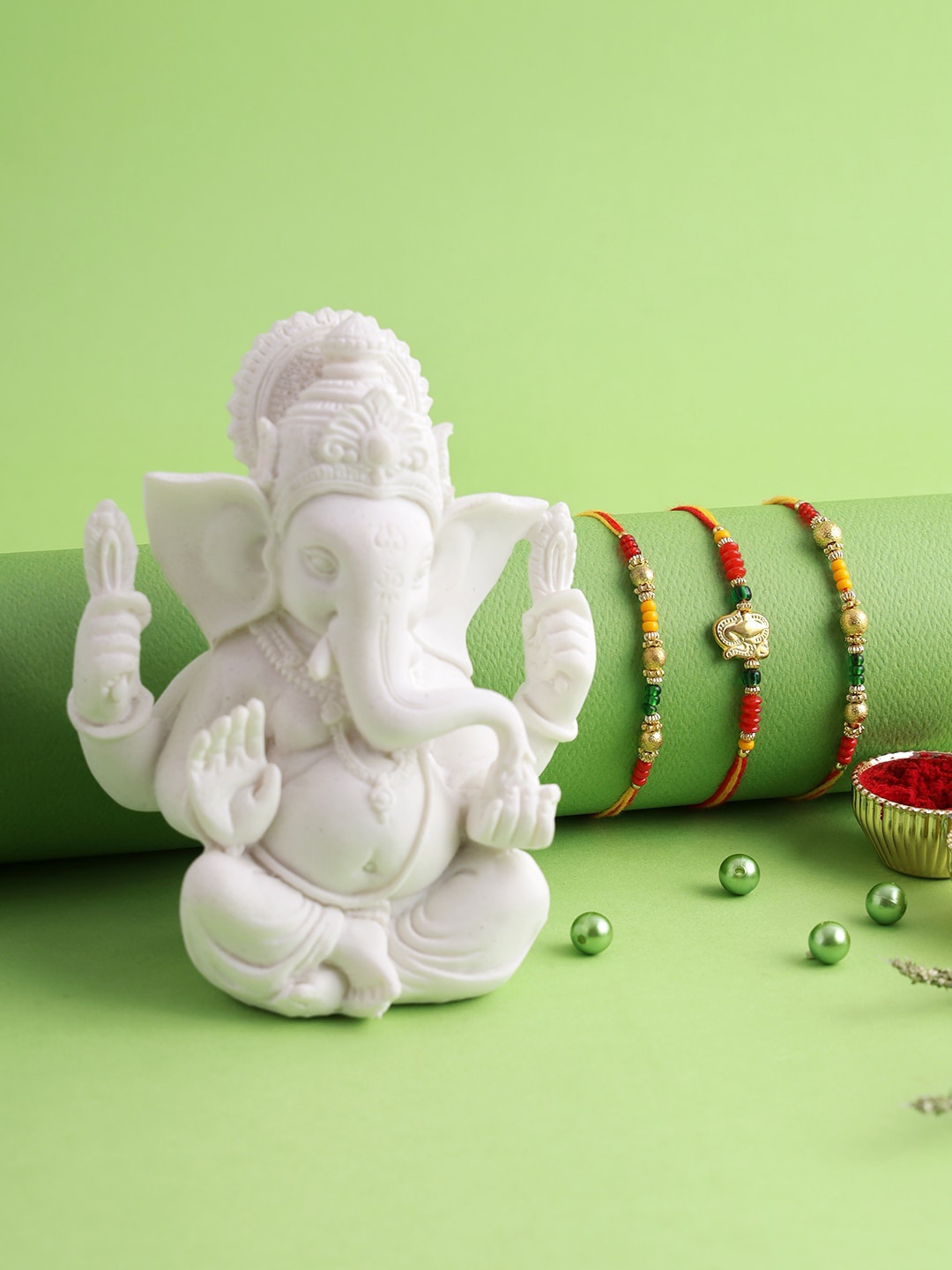 

Aapno Rajasthan Set of 3 Rakhi with Polyresin Ganesha Idol, Multi