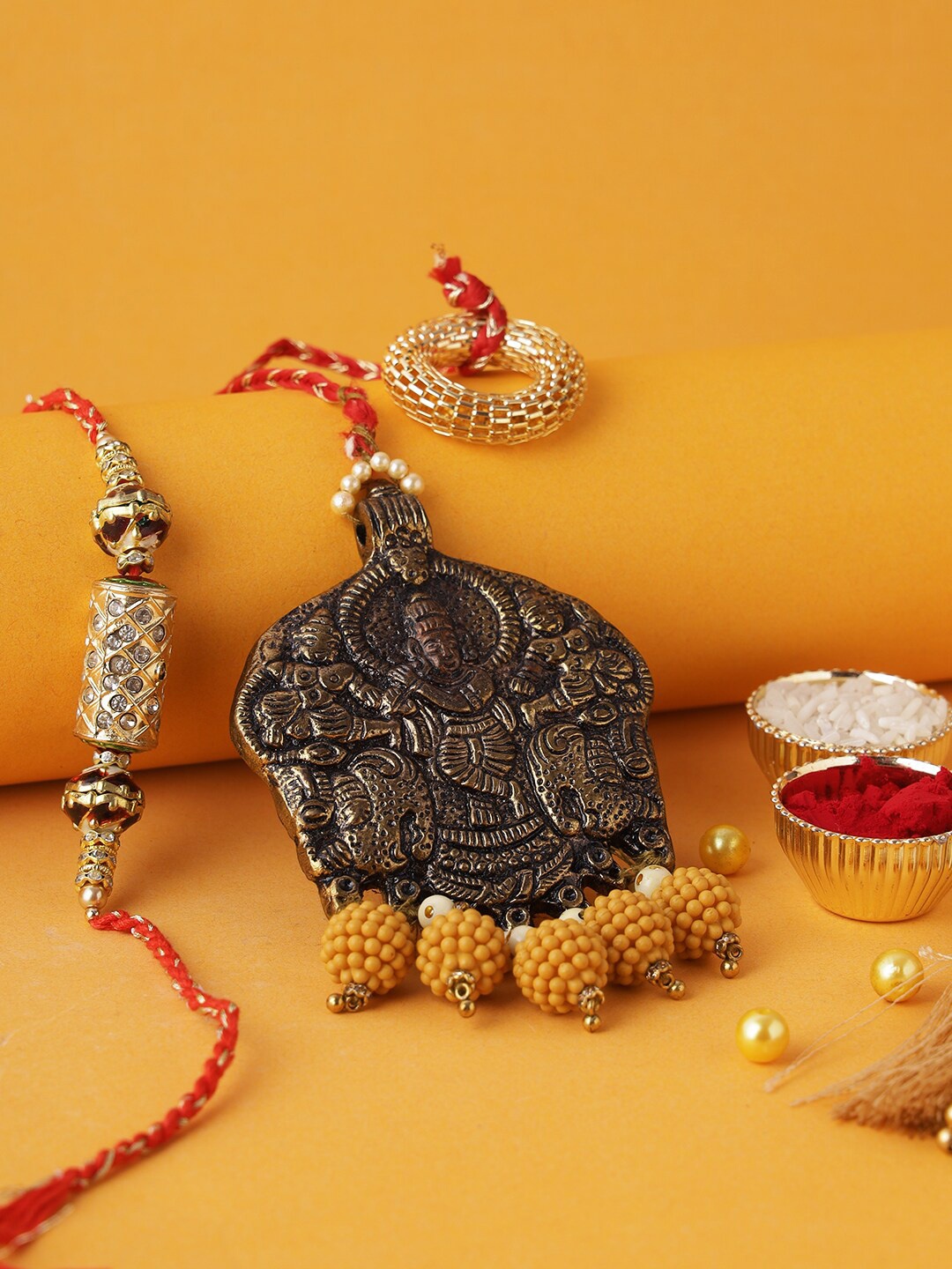 

Aapno Rajasthan Gold & Red Thread Rakhi With Roli Chawal & Raksha Bandhan Greeting Card