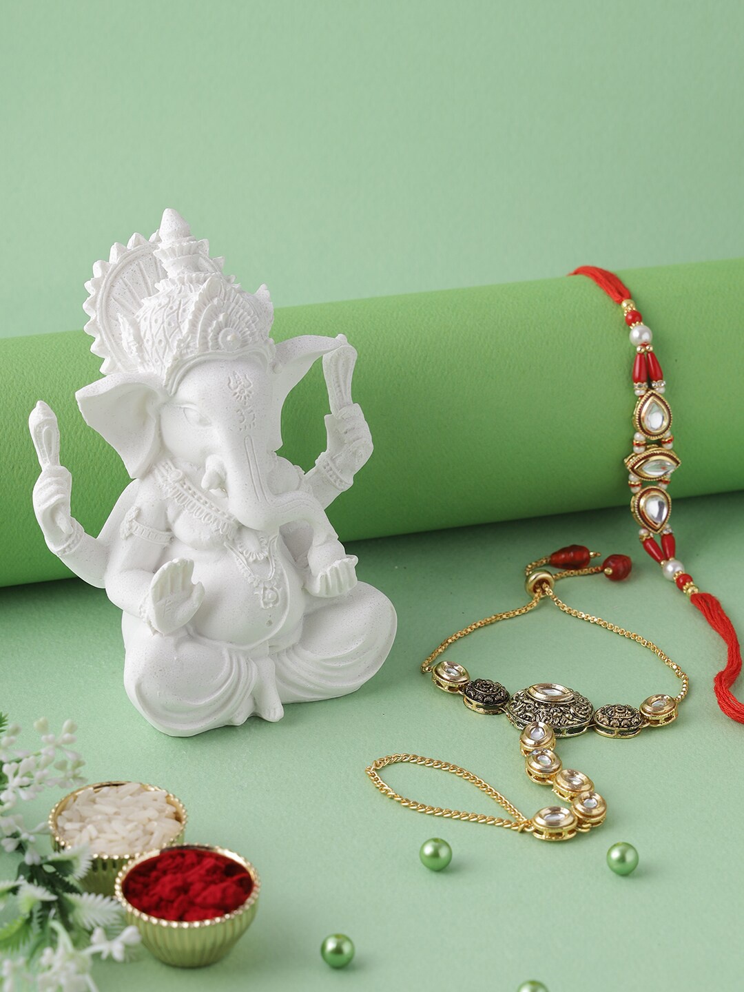 

Aapno Rajasthan Red & Gold-Toned Ganesha Bhaiya Bhabhi Rakhi Gift Set
