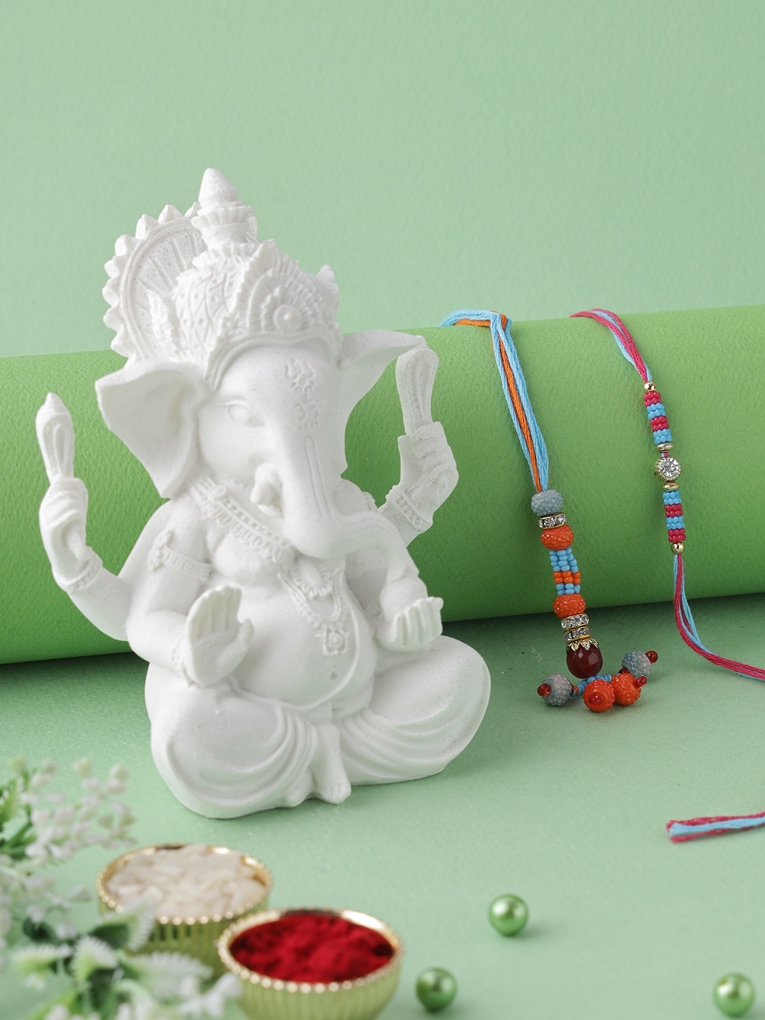 

Aapno Rajasthan Ganesha Idol with Bhaiya Bhabhi Rakhi Gift Set, Multi