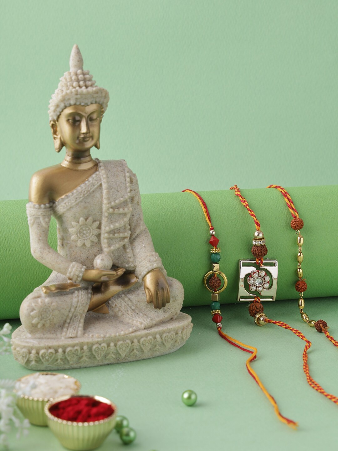 

Aapno Rajasthan Red & Gold-Toned Buddha Rakhi Gift Set