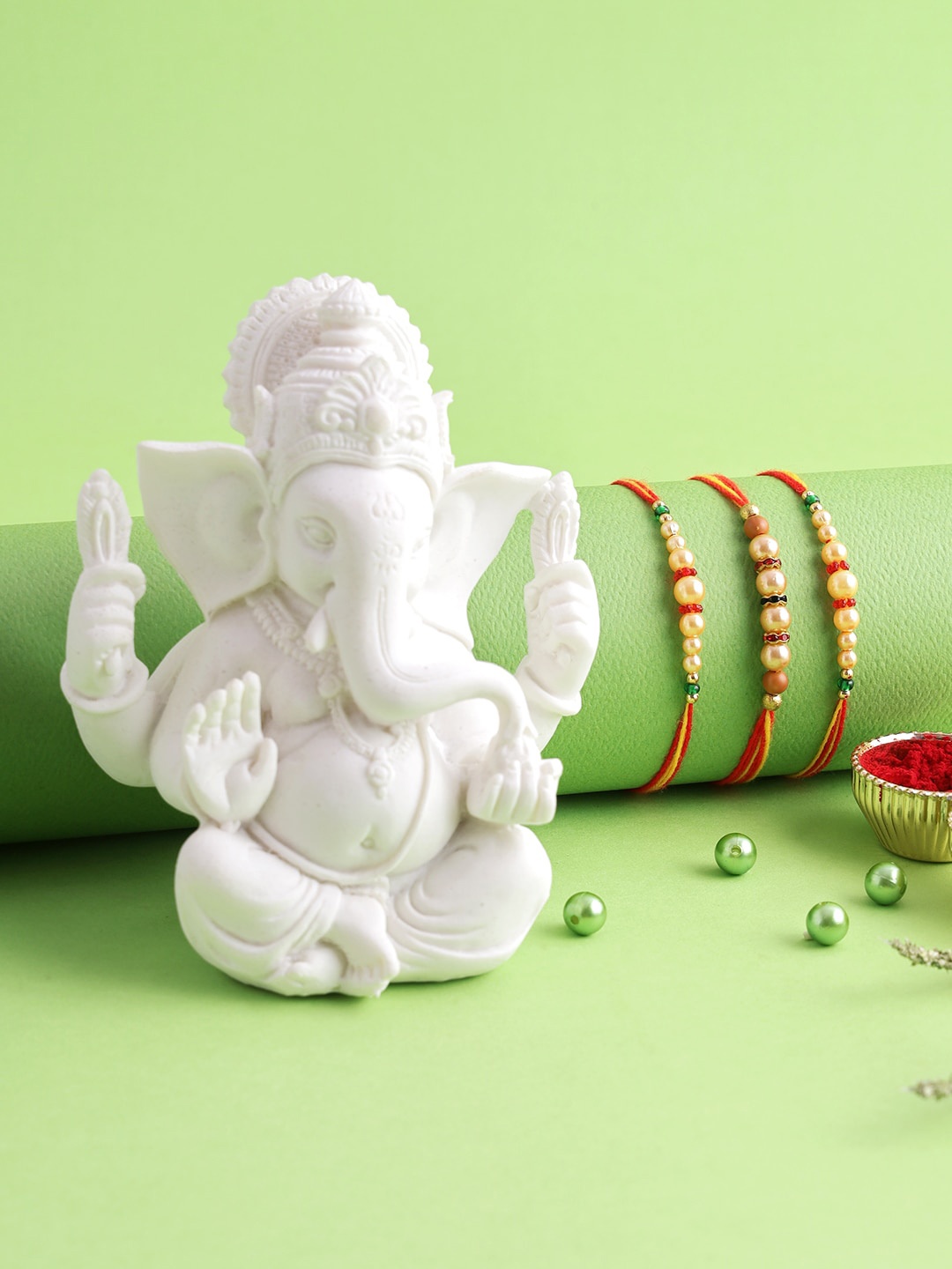 

Aapno Rajasthan Set of 3 Polyresin Ganesha Idol Rakhi, Red