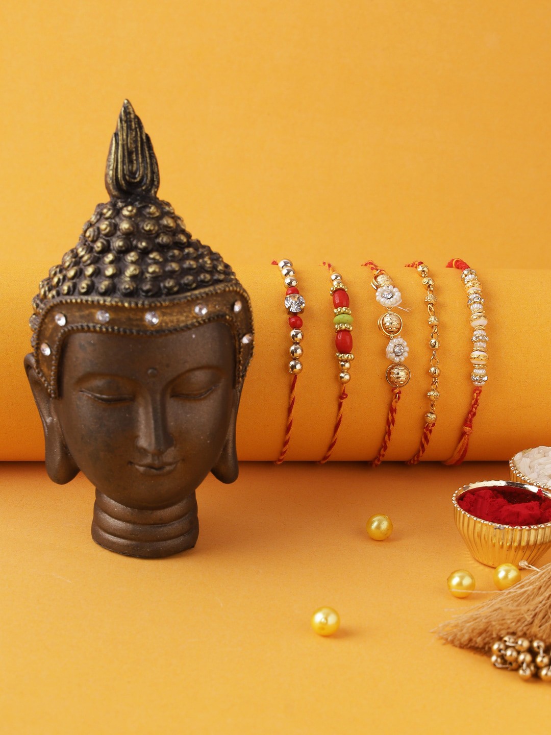 

Aapno Rajasthan Set Of 5 Elegant Rakhi & Minimalist Buddha Idol, Red