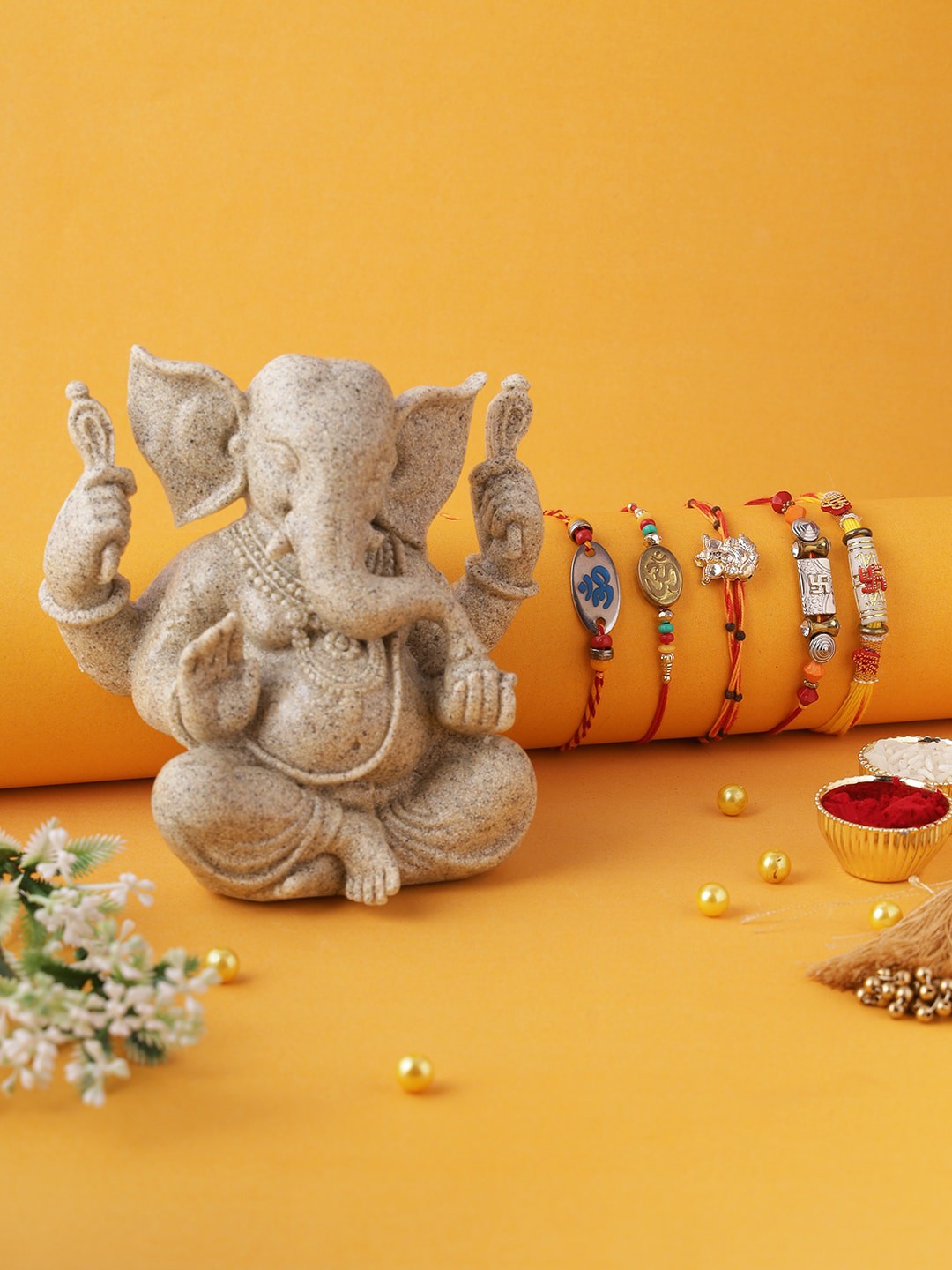 

Aapno Rajasthan Set of 5 Rakhi Beautiful and Pristine Sand Stone Ganesh Idol, Multi