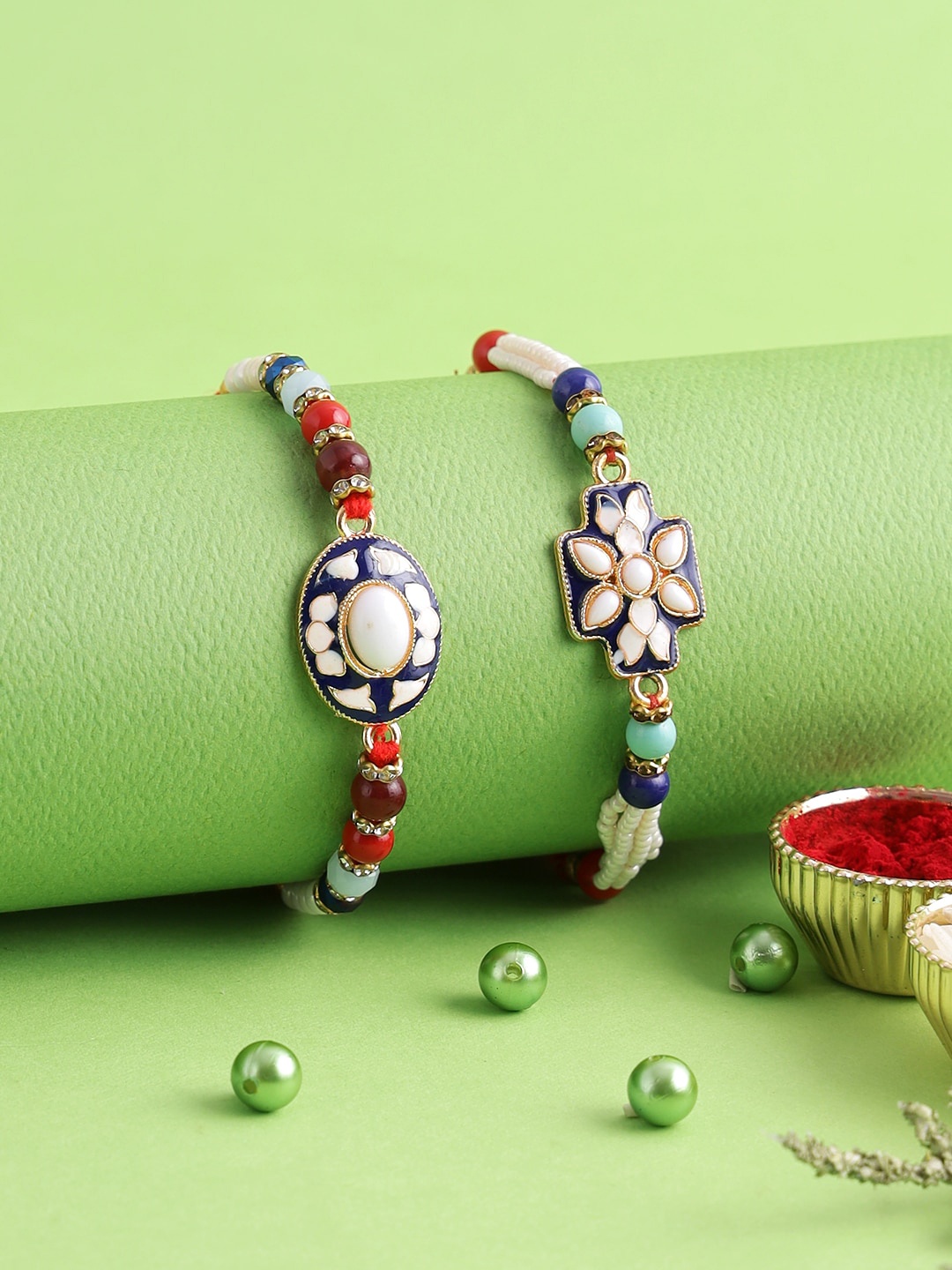 

Aapno Rajasthan Set of 2 Blue, White & Red Thread Meena Work Rakhi With Roli Chawal & Raksha Bandhan Greeting Card
