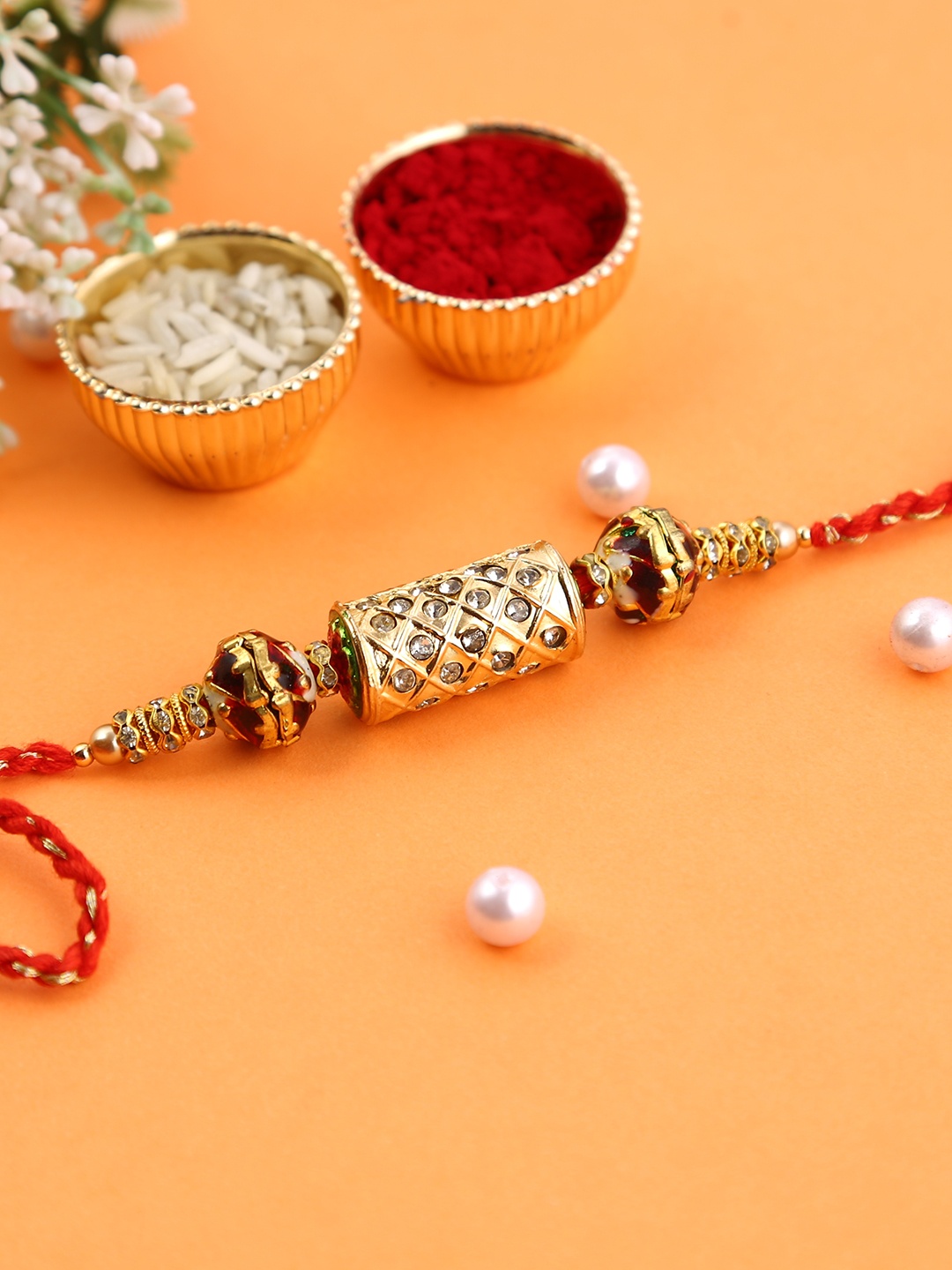 

Aapno Rajasthan Gold-Toned & Red Kundan Studded Bhabhi Rakhi