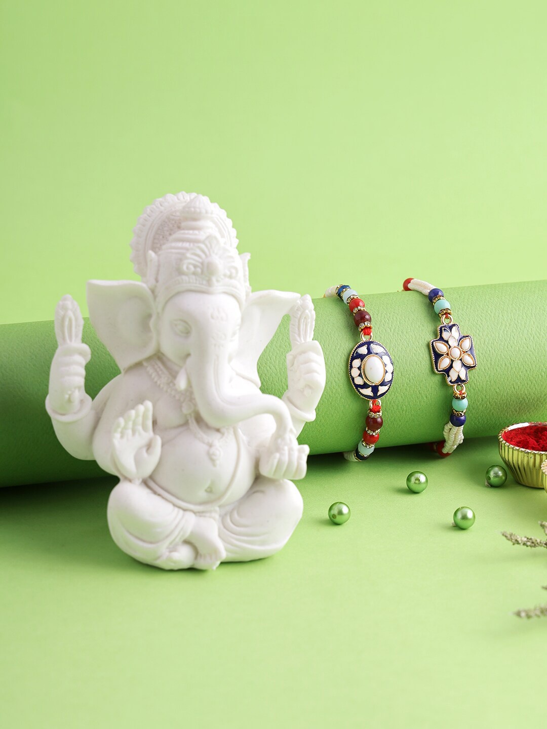 

Aapno Rajasthan Set of 2 Meena Work Rakhi With Ganesha Idol, Multi