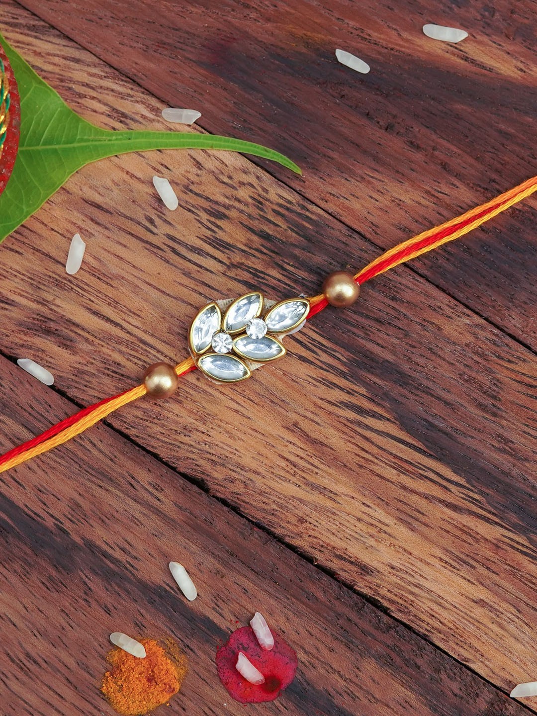 

The Magic Wand Red & White Leaf Thread Rakhi