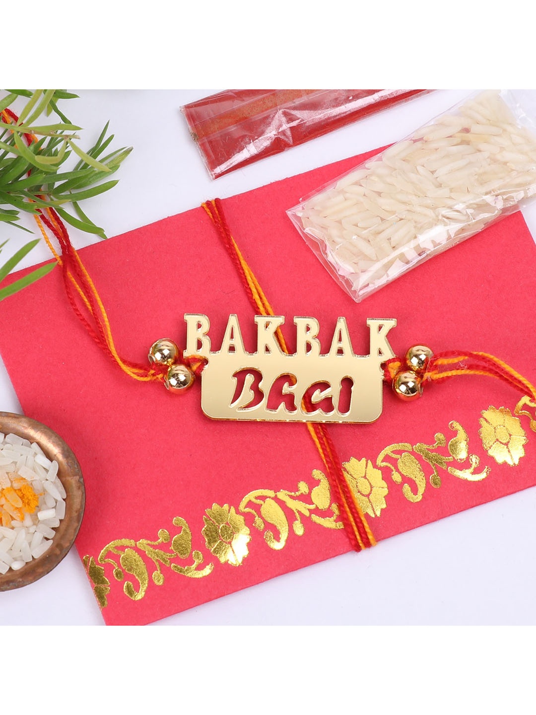 

The Magic Wand Gold Coloured & Red Bahbak Bhai Thread Rakhi