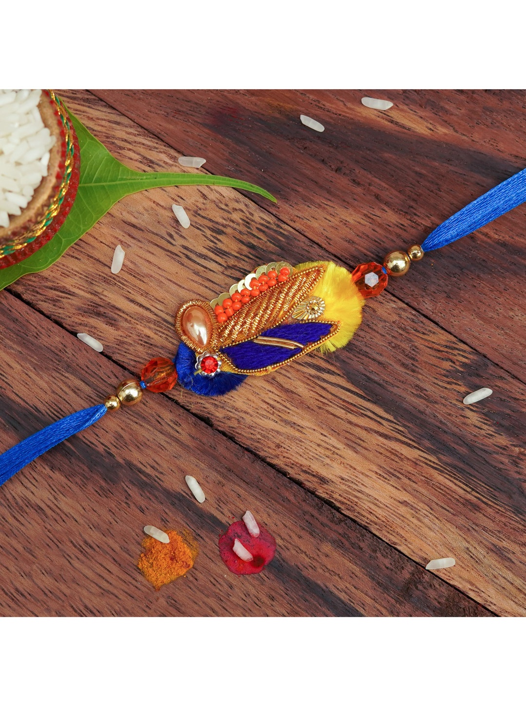 

The Magic Wand Blue Stone & Pearl Studded Rakhi