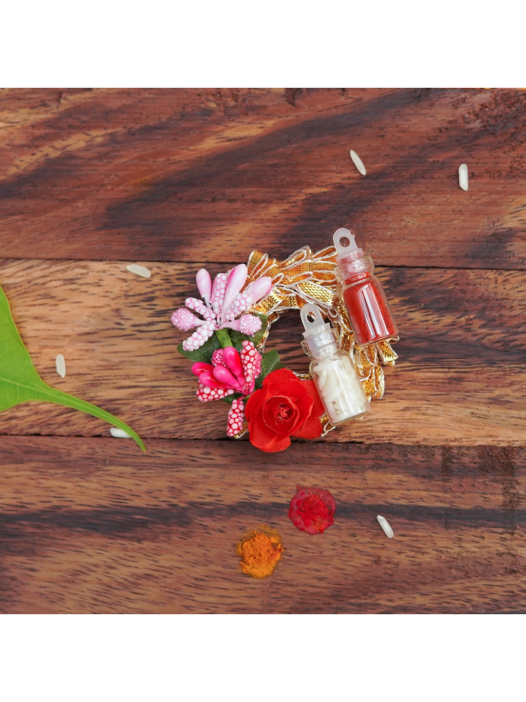 

The Magic Wand Red Rakhi With Roli Chawal In Decorative Mini Vial