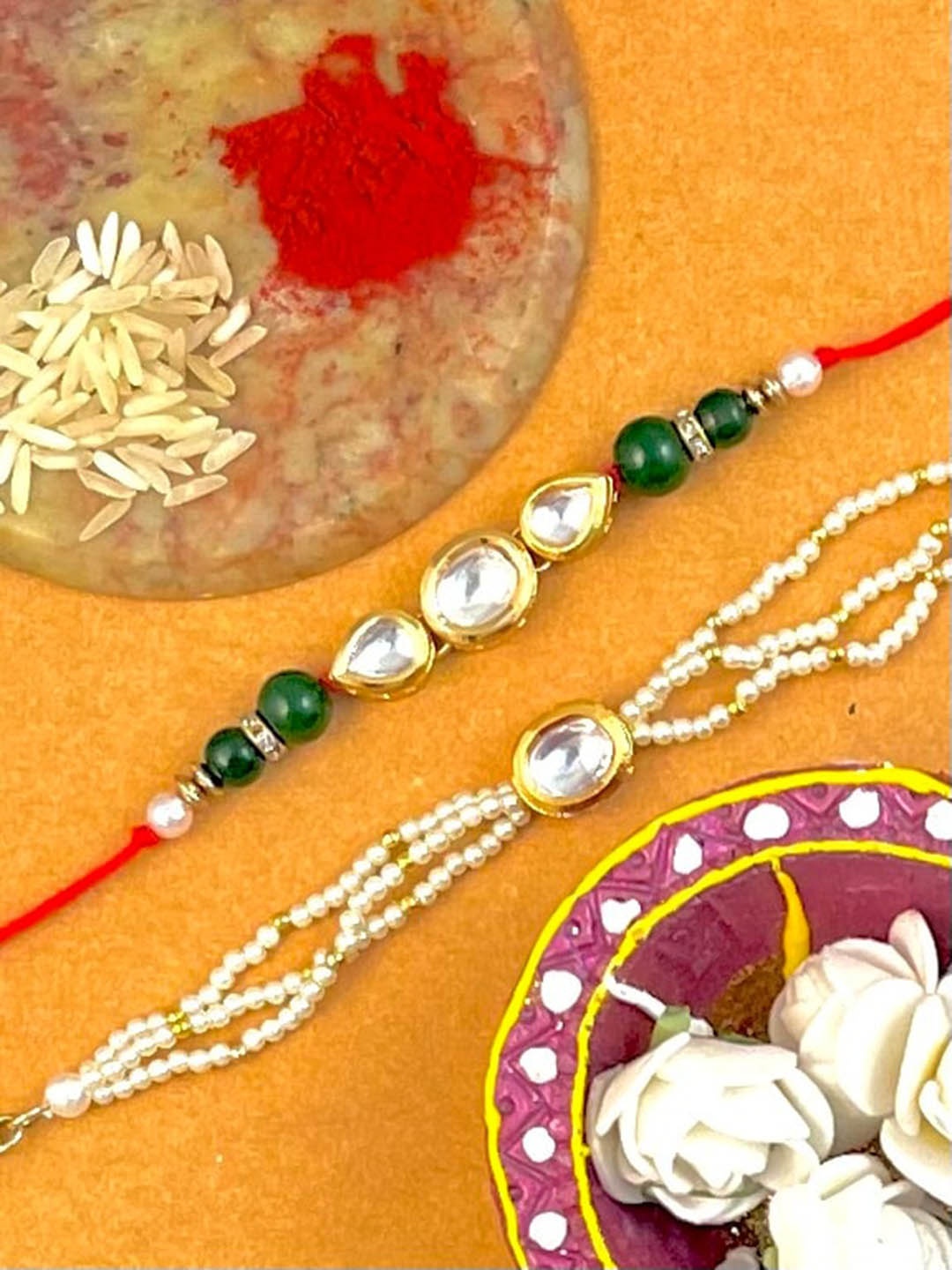 

KARATCART Set Of 2 Gold-Plated Kundan Studded Rakhi & Lumba