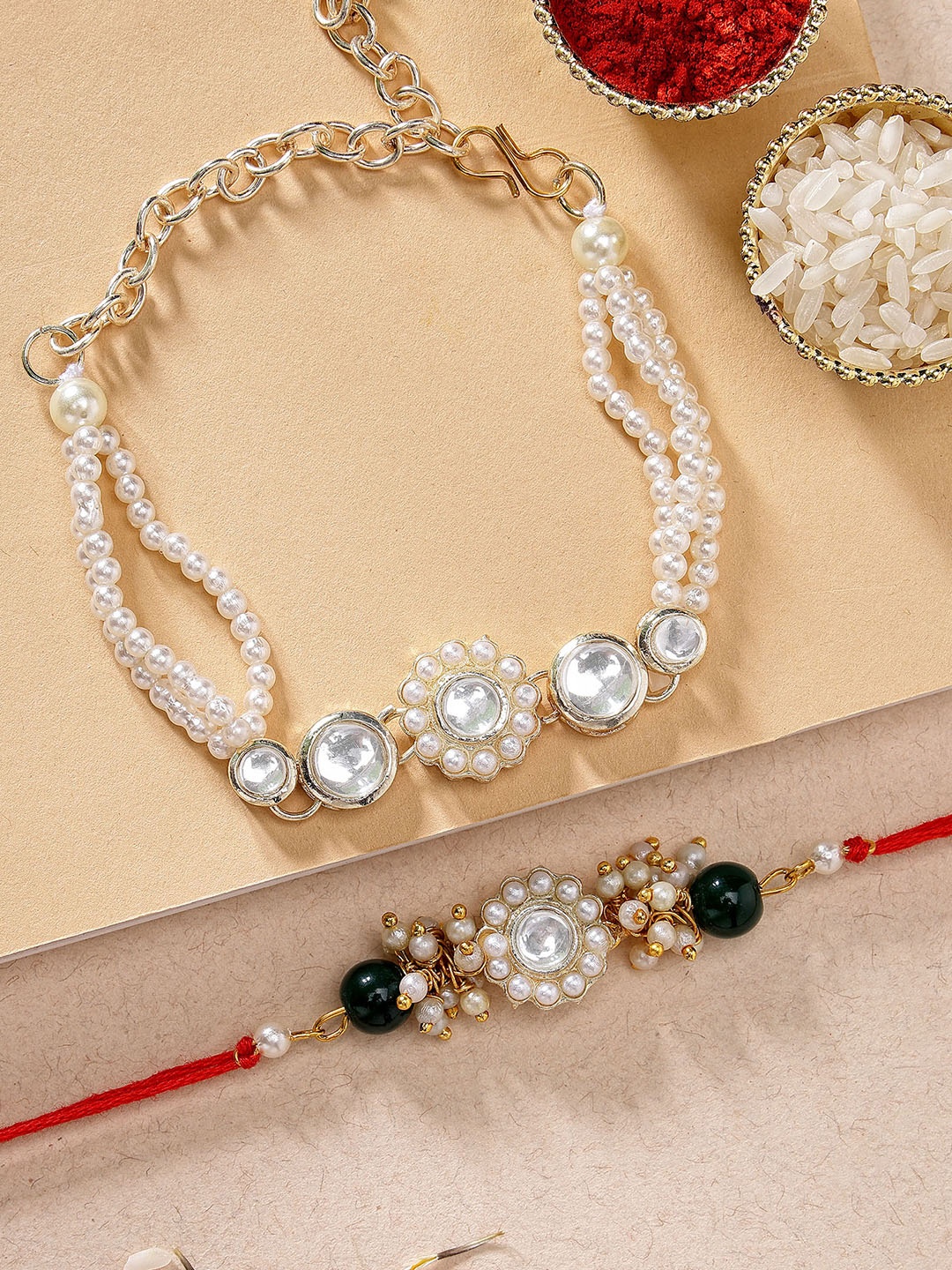 

KARATCART Set Of 2 Gold-Toned & White Stone-Studded & Beaded Rakhi With Roli Chawal
