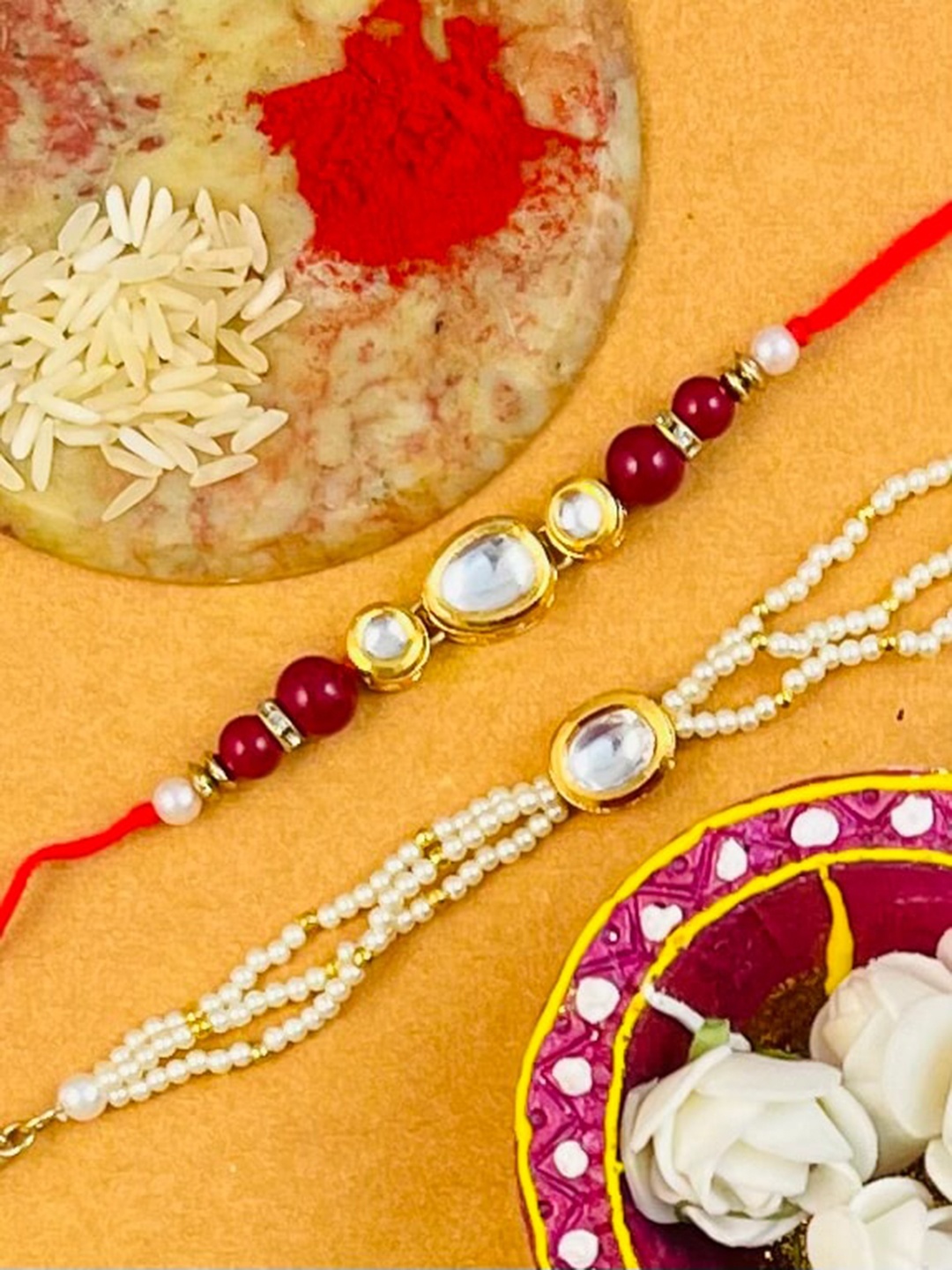 

KARATCART Set Of 2 Gold-Plated & Red Kundan Rakhi