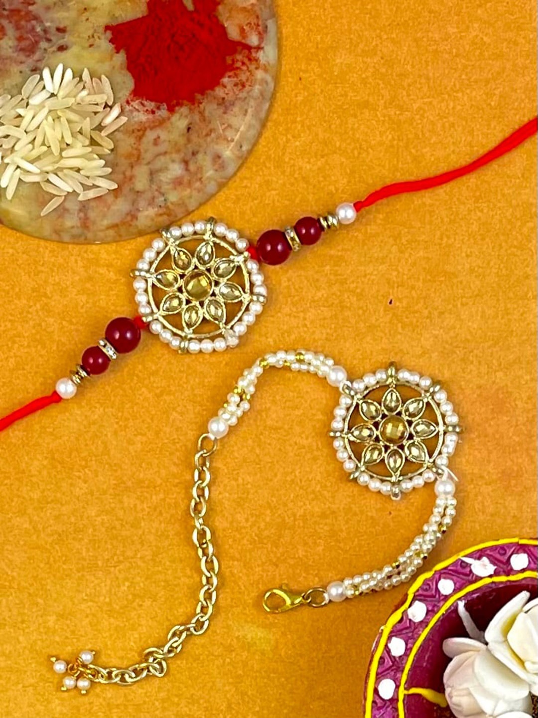 

KARATCART Set Of 2 Gold-Toned & White Stone-Studded & Beaded Rakhi With Roli & Chawal