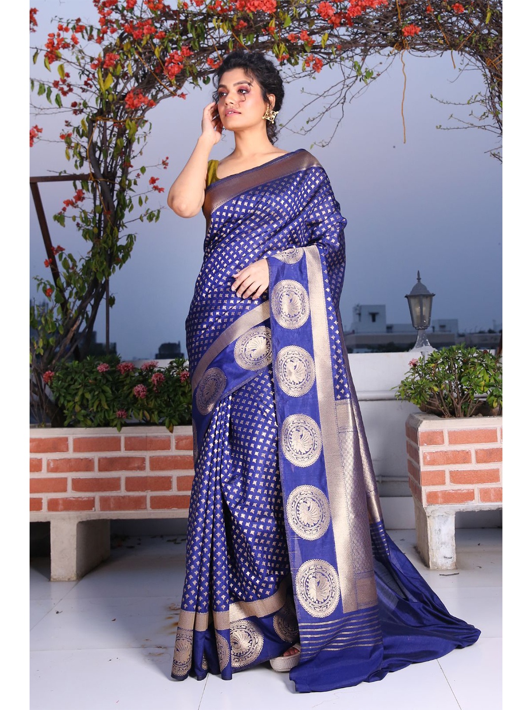 

Charukriti Blue & Gold-Toned Ethnic Motifs Zari Brocade Saree