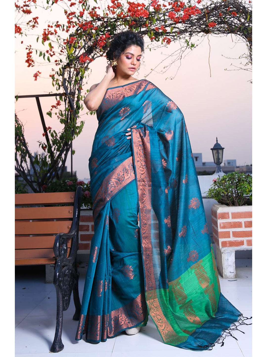 

Charukriti Women Teal & Gold-Toned Woven Design Zari Silk Blend Saree