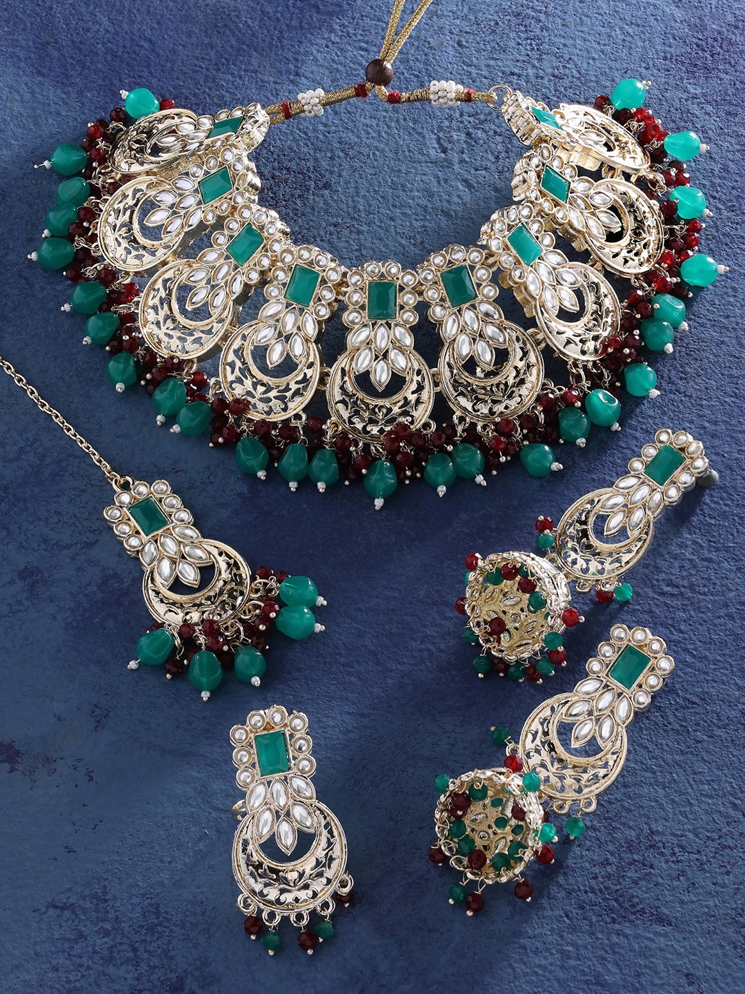 

Zaveri Pearls Gold-Plated Green & Maroon Kundan Beaded Bridal Jewellery Set