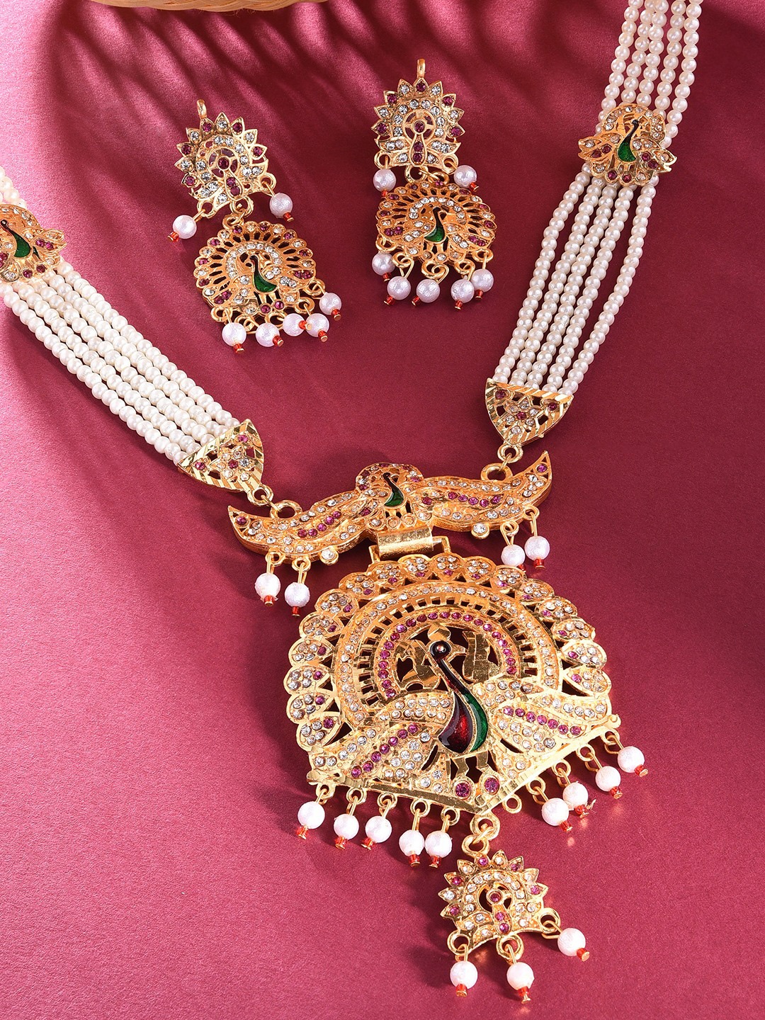 

Zaveri Pearls Women Gold-Plated White & Pink Stone-Studded & Pearl Beaded Jewelry Set
