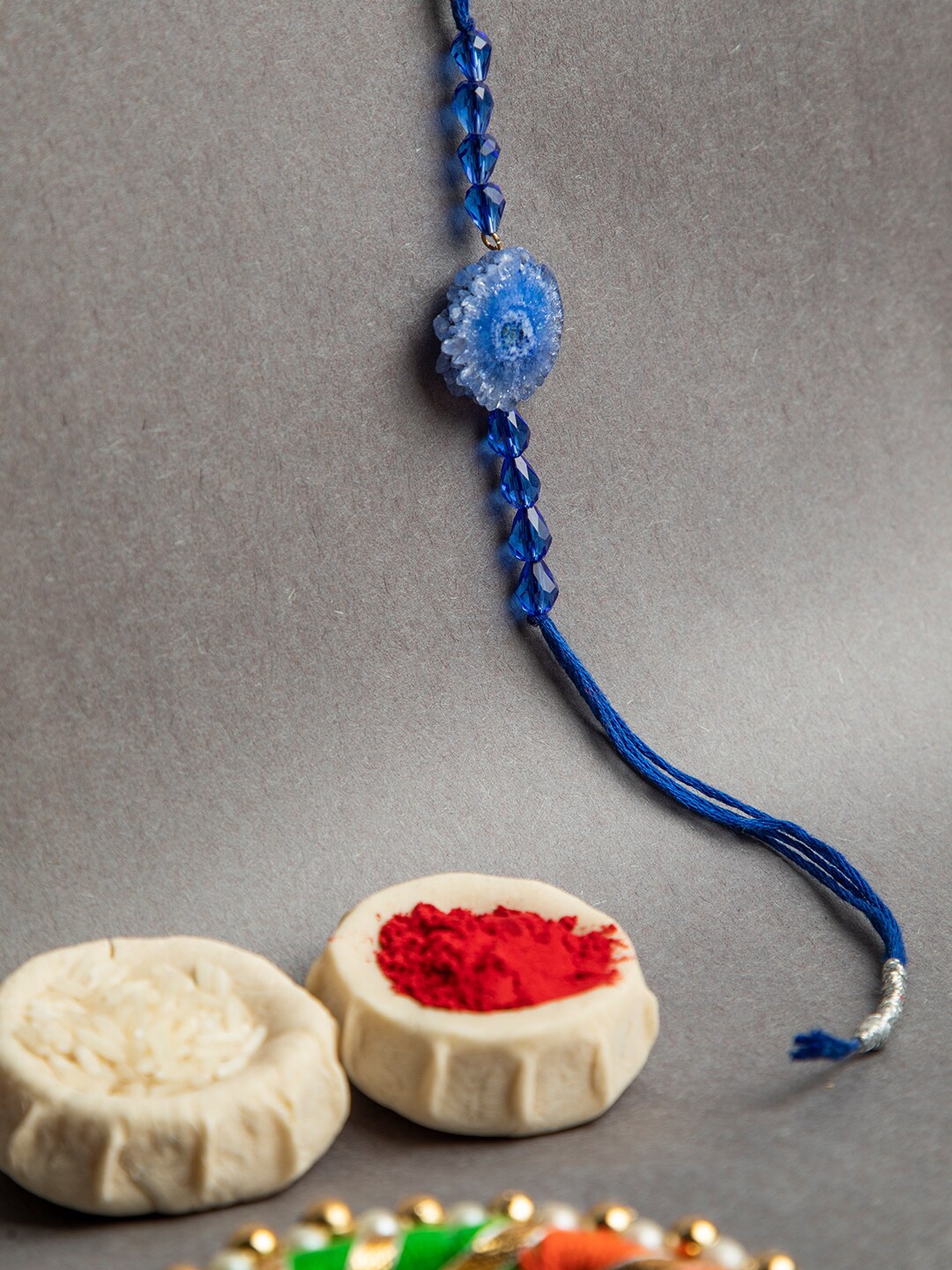 

DEEBACO Blue Beaded Rakhi With Roli Chawal