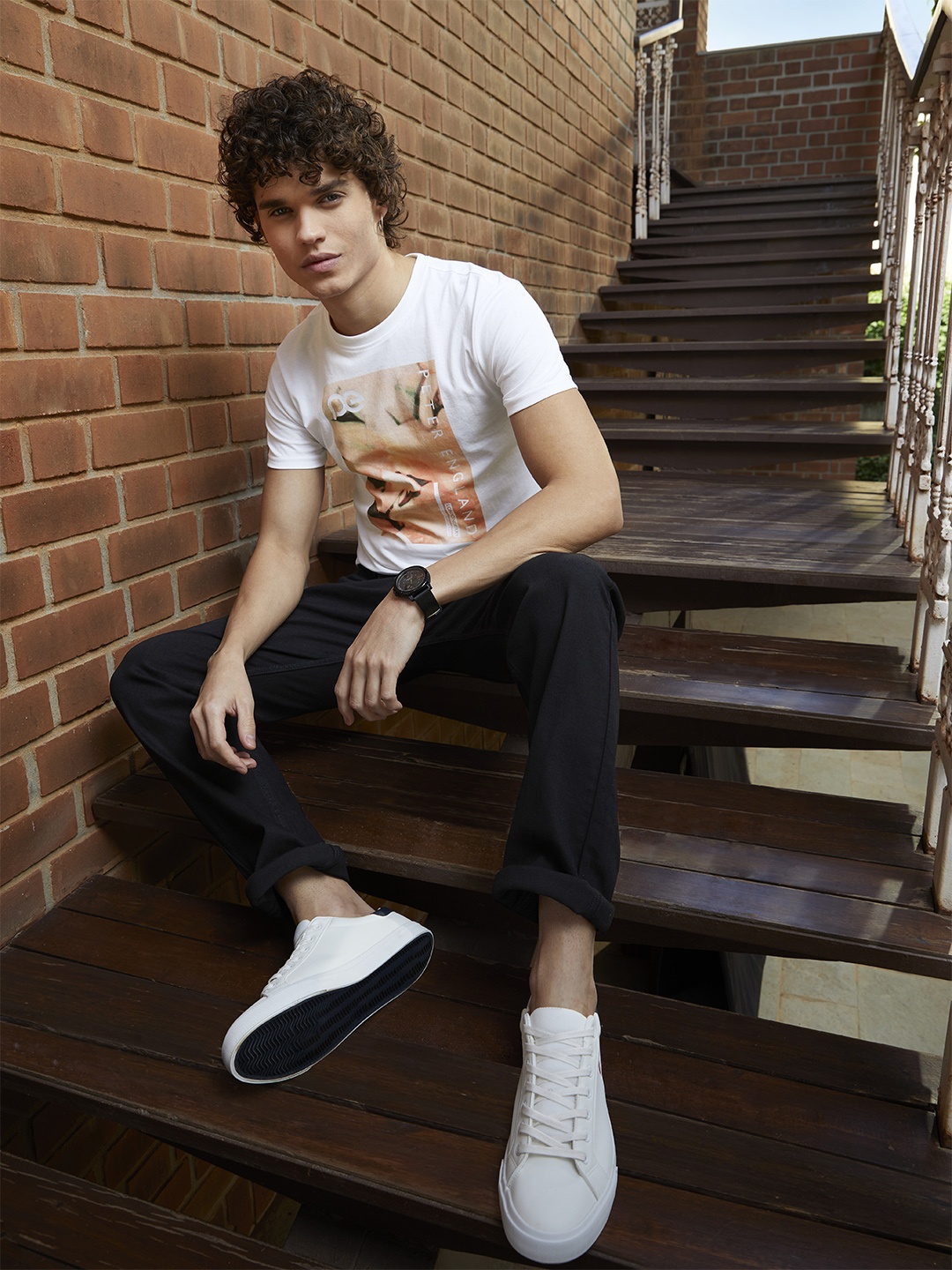 

Peter England Casuals Men White & Orange Brand Logo Printed T-shirt
