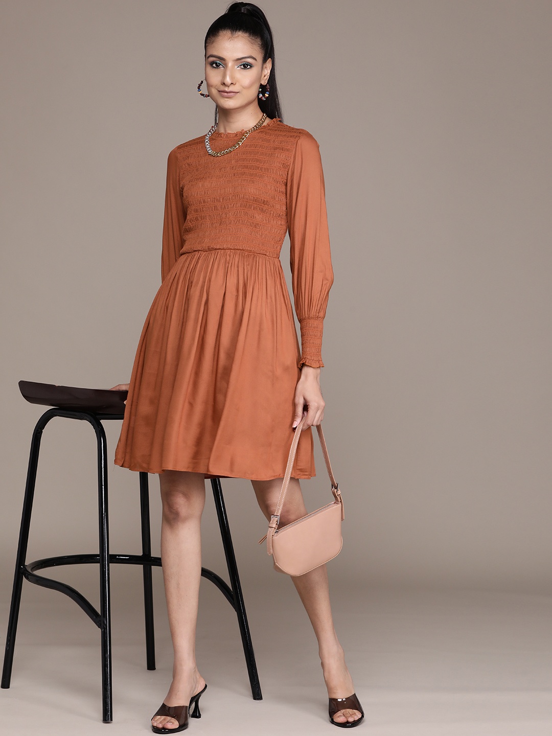 

Label Ritu Kumar Brown Solid Smocked A-Line Dress