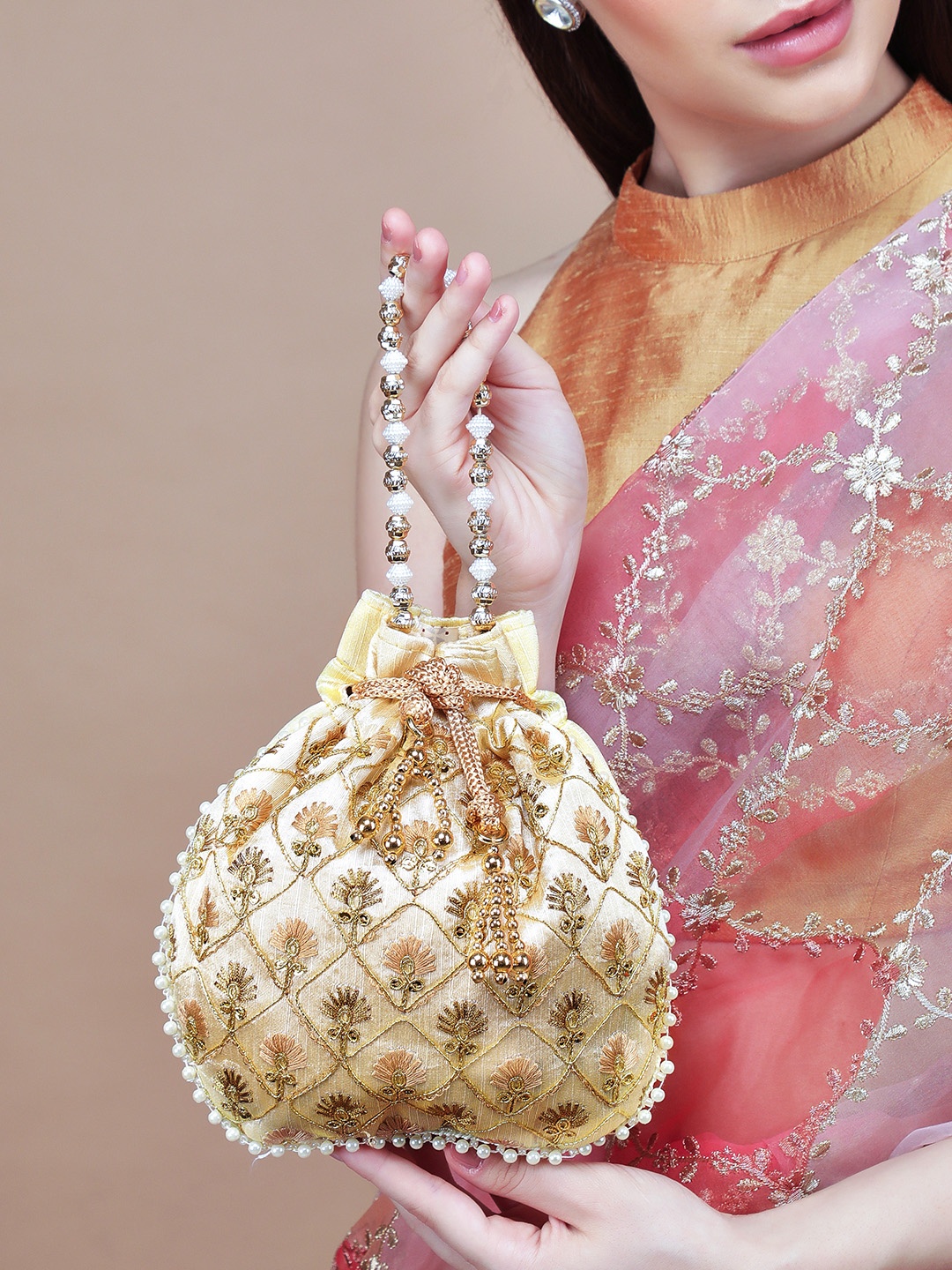 

Rubans Gold-Toned & Cream-Coloured Embroidered Tasselled Potli Clutch