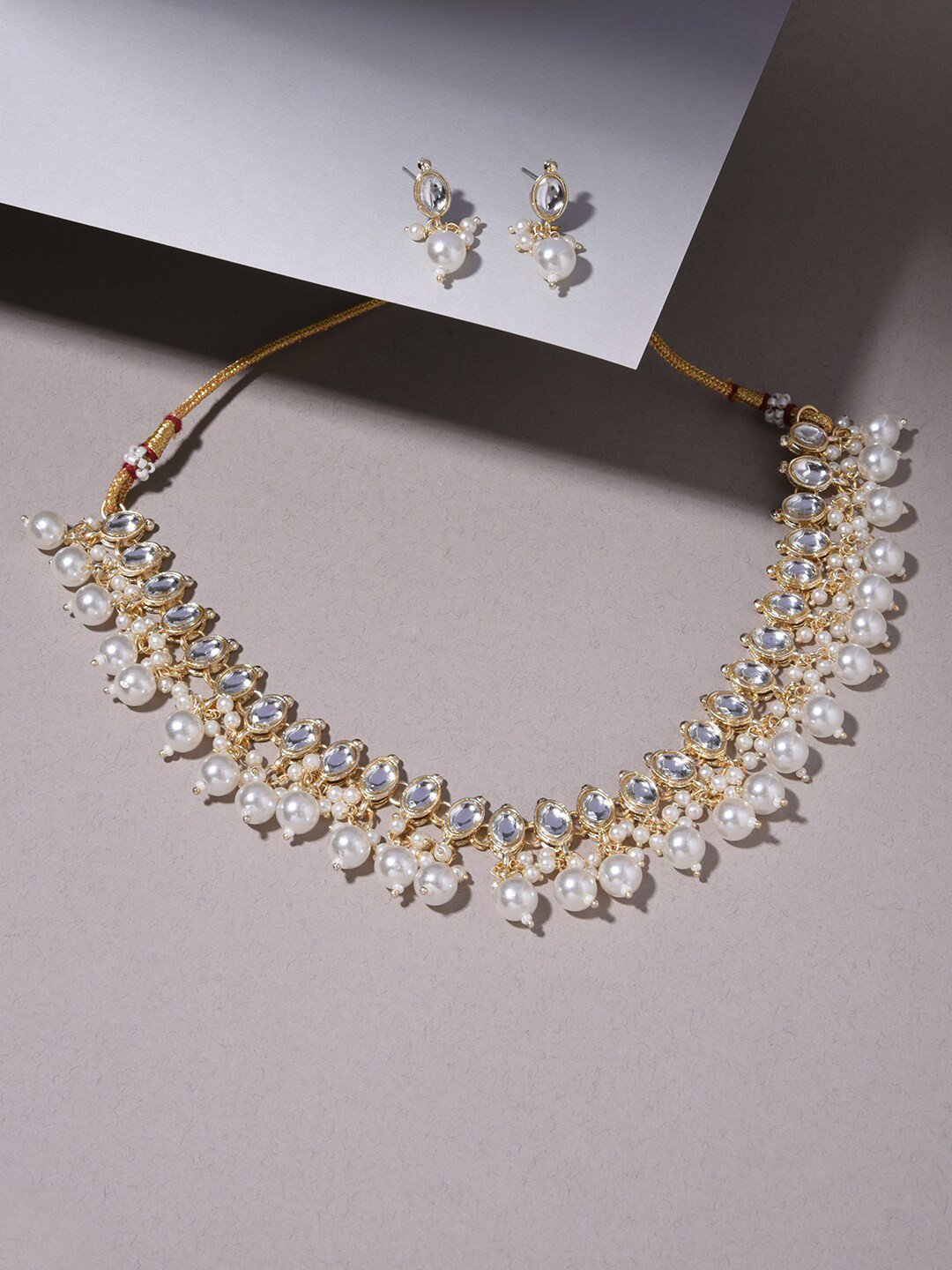 

Fida Gold-Plated White Stone Studded & Beaded Handcrafted Jewellery Set