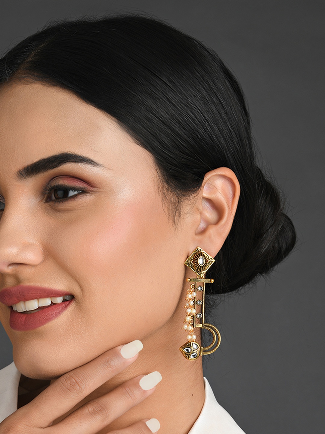 

Fida White Contemporary Drop Earrings