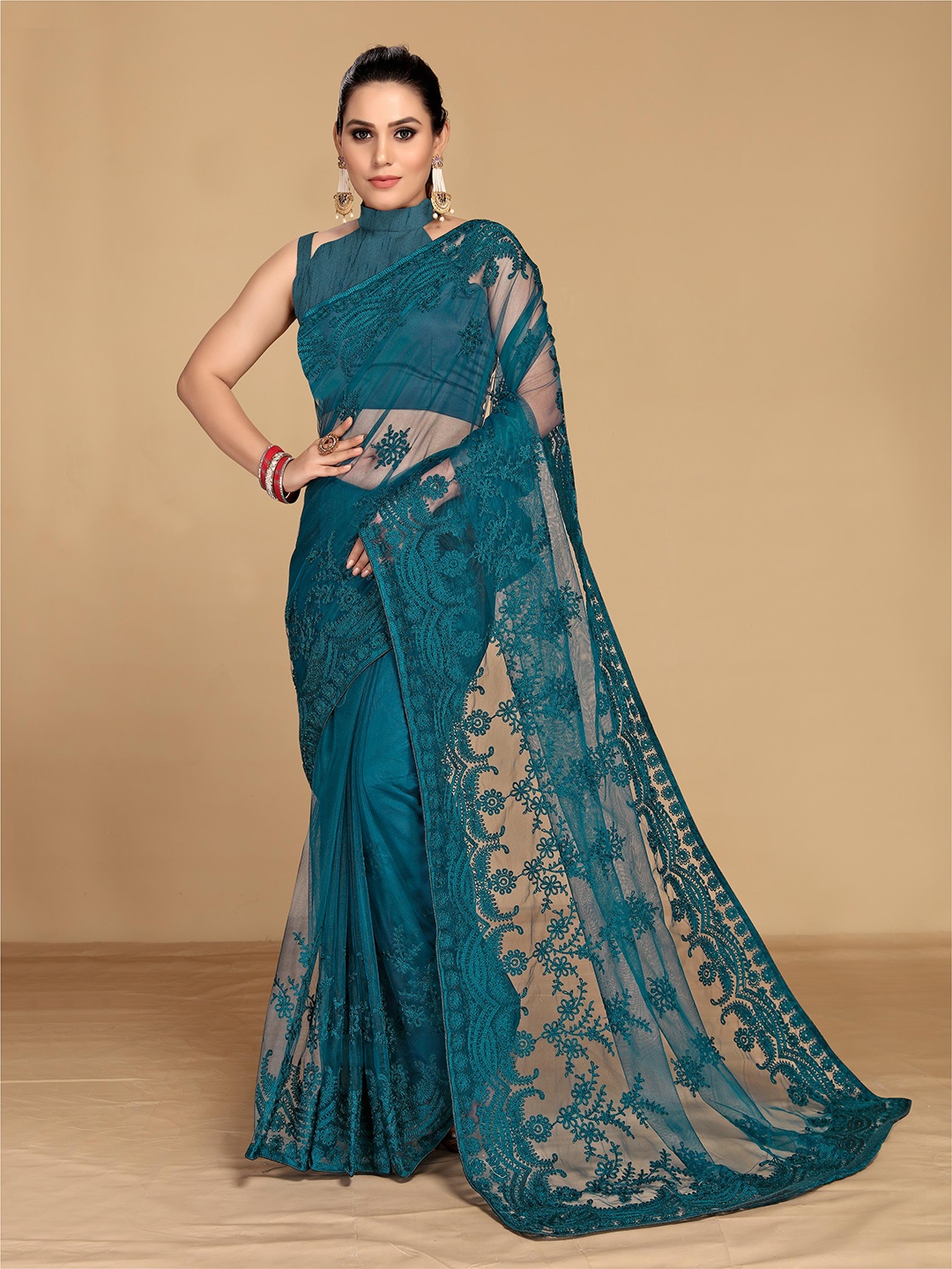 

VAIRAGEE Teal Embellished Embroidered Net Saree