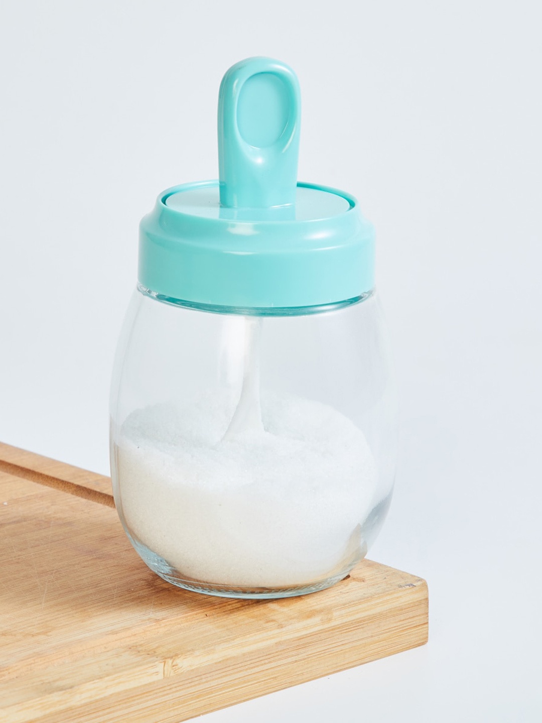 

Home Centre Blue Solid Glass Bottle With Silicone Lid & Spoon - 290ML
